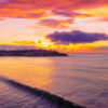 Slice of Bondi Beach. Long wave breaking during a beautiful golden pink sunrise over Ben Buckler Bondi.