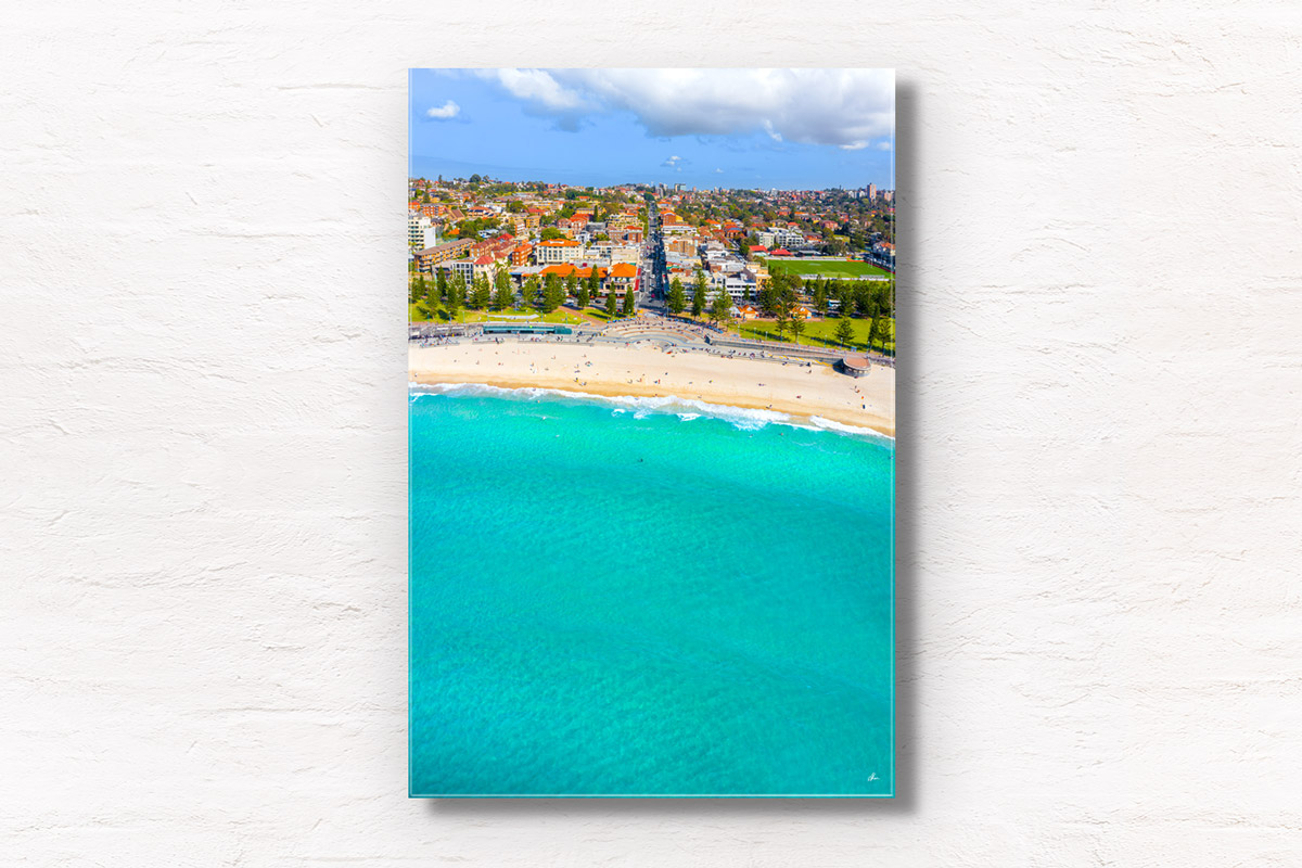 Aerial photography above turquoise clear ocean at Coogee Beach. Framed art photography wall art print.