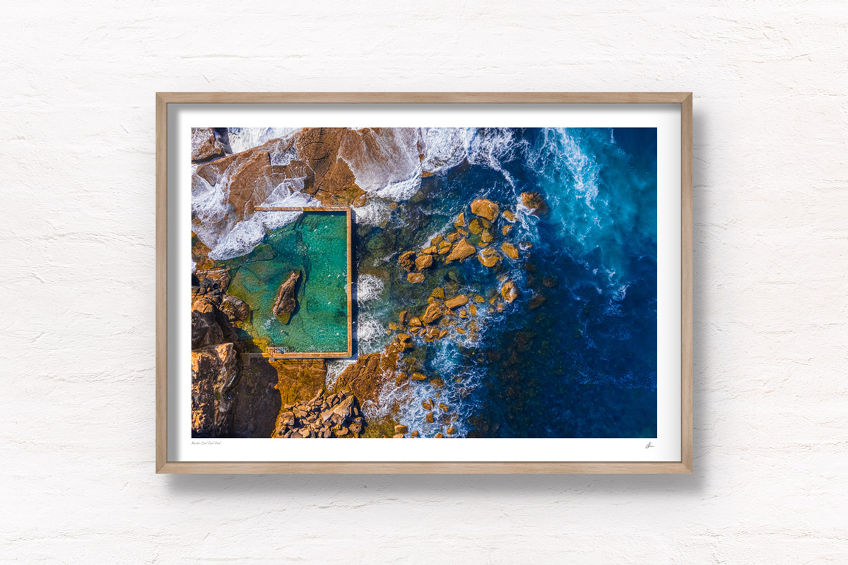 Birds eye aerial view above one of Sydney's best rockpools, North Curl Curl Pool. Framed art photography wall art print.