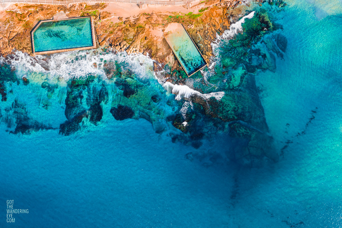 Aerial view above the Cronulla rockpools on a clear day and aqua coloured water.