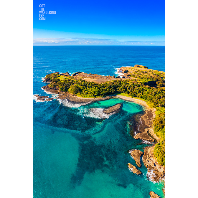 Aerial view above The emerald coloured ocean at The Boneyard Beach in Kiama NSW.