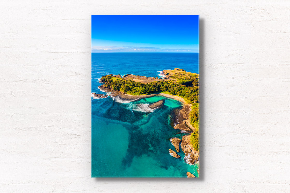 Aerial view above The emerald coloured ocean at The Boneyard Beach in Kiama NSW. Framed art photography wall art print by Allan Chan.