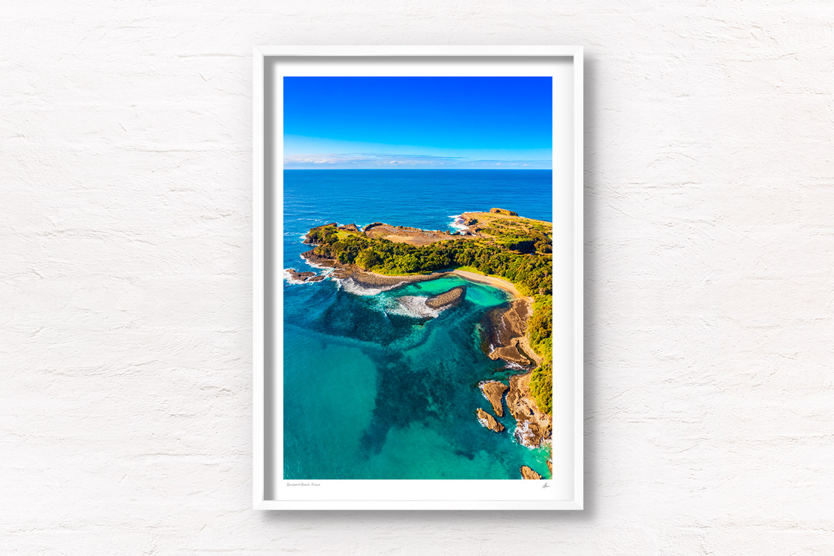 Aerial view above The emerald coloured ocean at The Boneyard Beach in Kiama NSW. Framed art photography wall art print by Allan Chan.