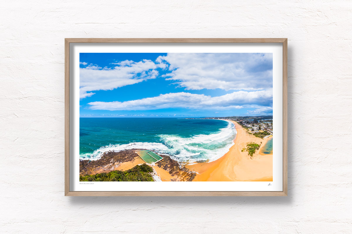 Aerial view above North Narrabeen rock pool and beach looking back towards Collaroy Beach. Framed art photography wall art print by Allan Chan.
