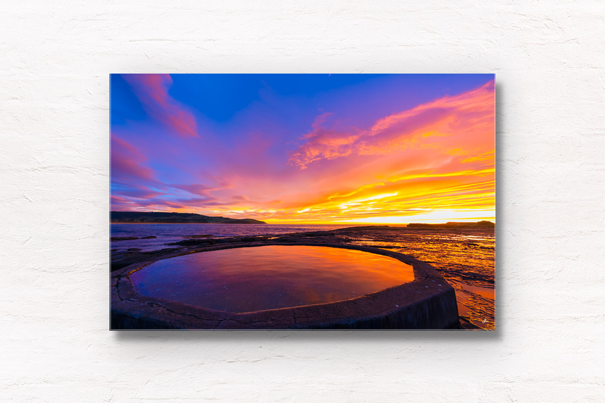 Fiery sunrise over Ourie Pool Werri Beach in NSW South Coast. Framed art photography wall art print by Allan Chan.