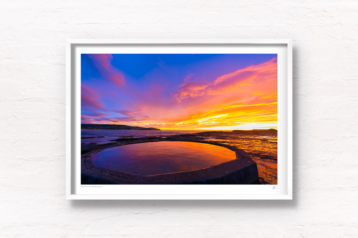 Fiery sunrise over Ourie Pool Werri Beach in NSW South Coast. Framed art photography wall art print by Allan Chan.