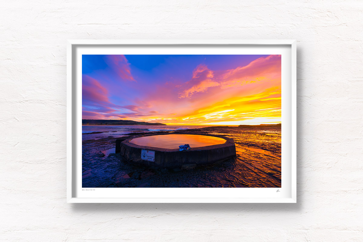 Purple and orange sunrise fluffy clouds above Werri Beach and round ocean rock pool. Framed art photography wall art print by Allan Chan.
