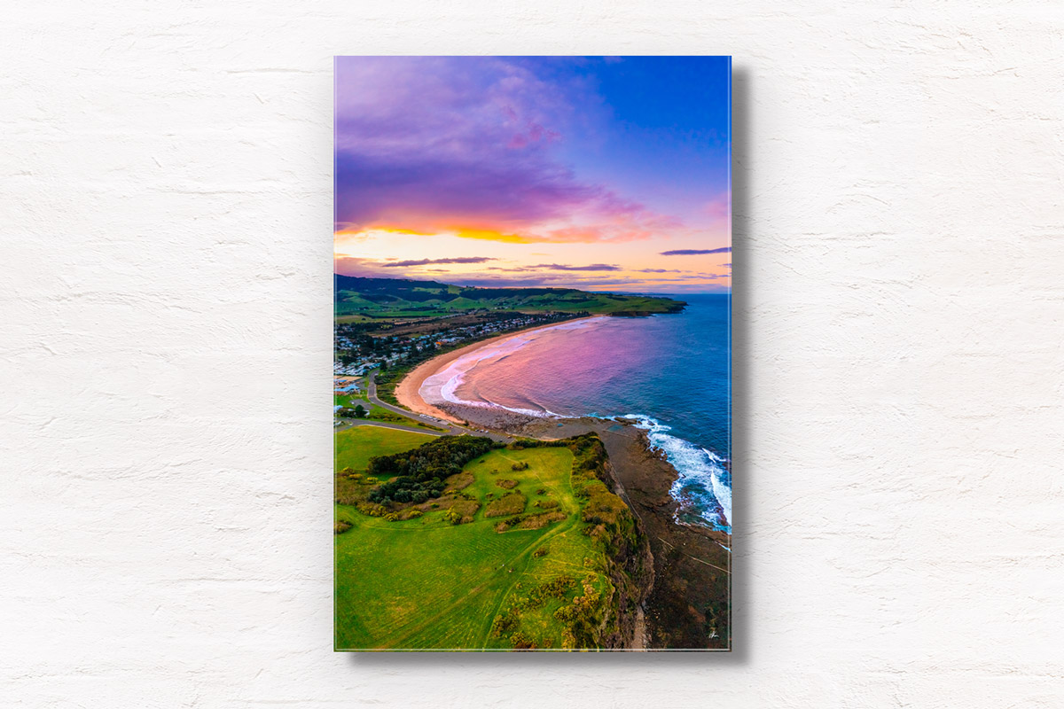Aerial above Gerringong headland looking back at a purple sky sunset over Werri Beach. Framed art photography wall art print by Allan Chan.