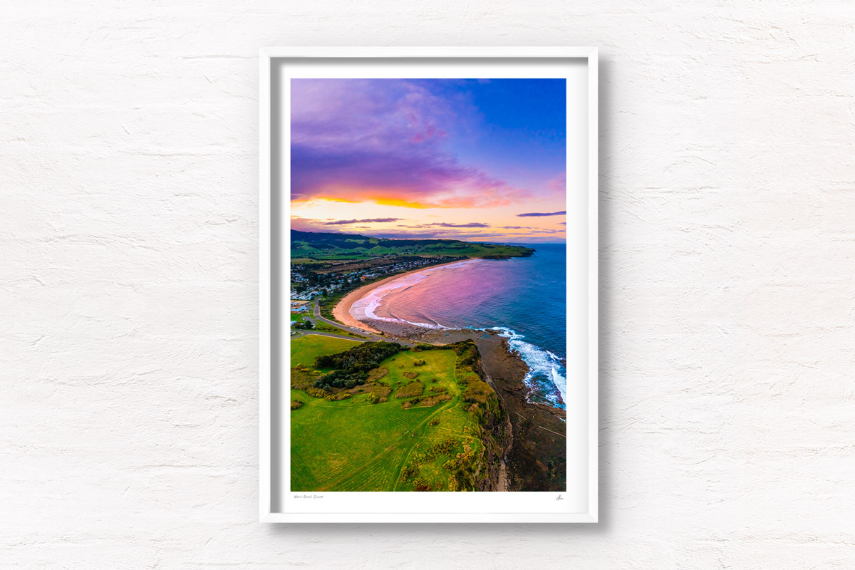 Aerial above Gerringong headland looking back at a purple sky sunset over Werri Beach. Framed art photography wall art print by Allan Chan.