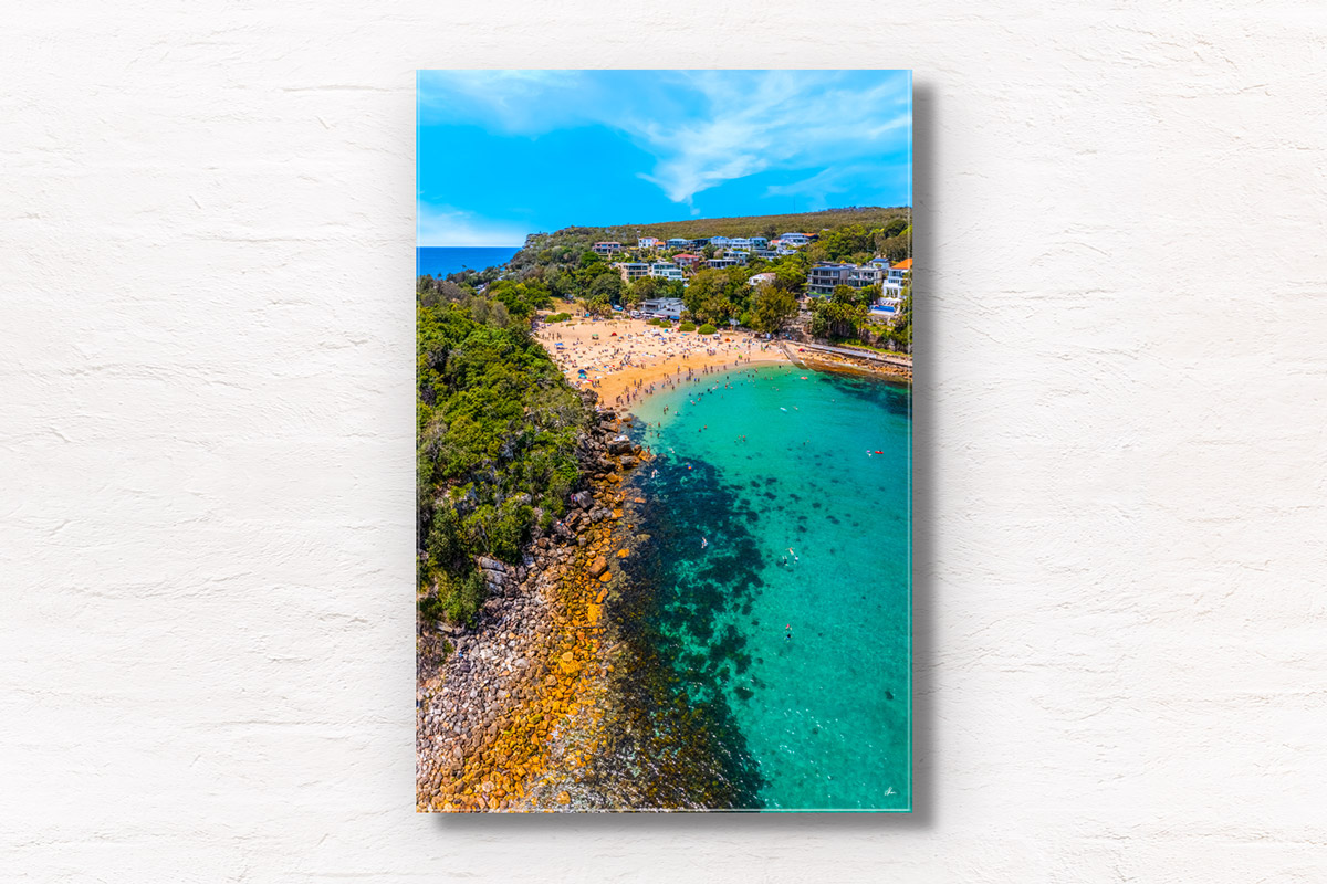 Aerial photo above Shelly Beach of swimmers enjoying a summers day in Manly. Framed art photography wall art print by Allan Chan.
