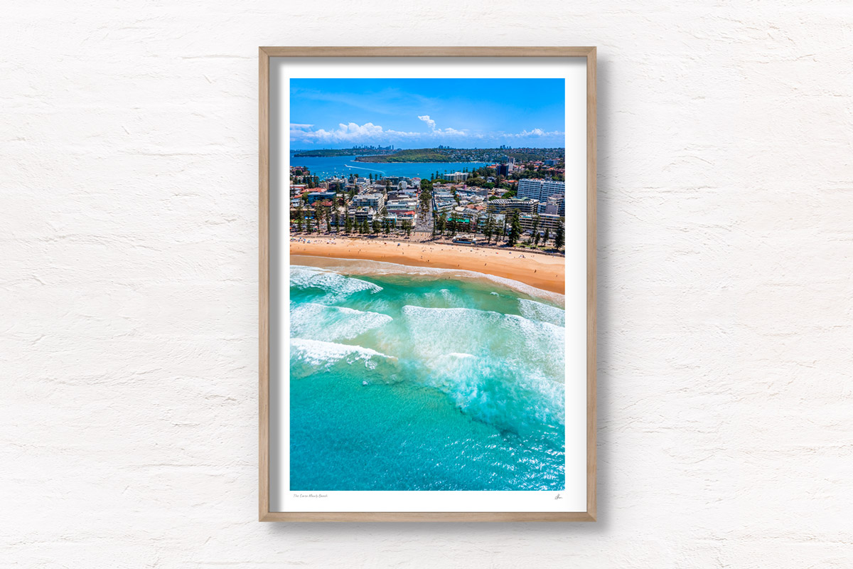 Aerial photo looking back towards The Corso from Manly Beach on a beautiful clear day. Framed aerial photography wall art print by Allan Chan.
