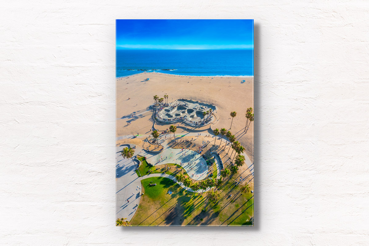 Aerial view above Venice Beach Skatepark, skateboarders and rollerbladers enjoying Summer. Framed art travel photography wall art prints by Allan Chan.