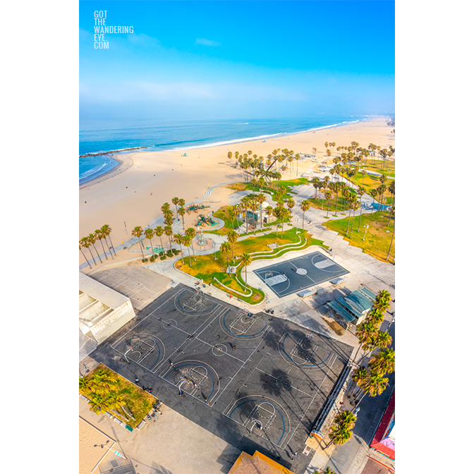 Aerial view above Venice Beach Basketball Courts on a clear blue sky summers day. Framed art photography, wall art prints by Allan Chan.