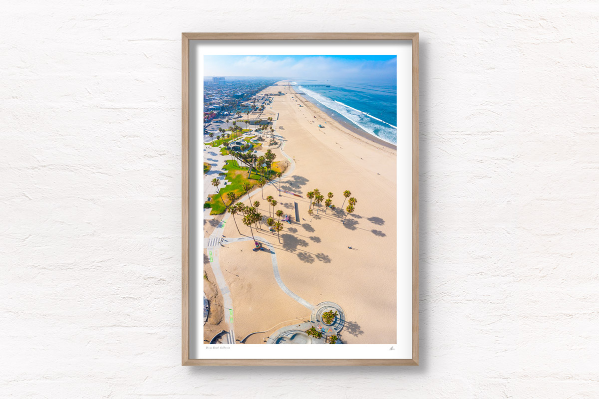 Venice Beach California Aerial above the palm trees and bike path boardwalk. Framed art photography wall art prints by Allan Chan.