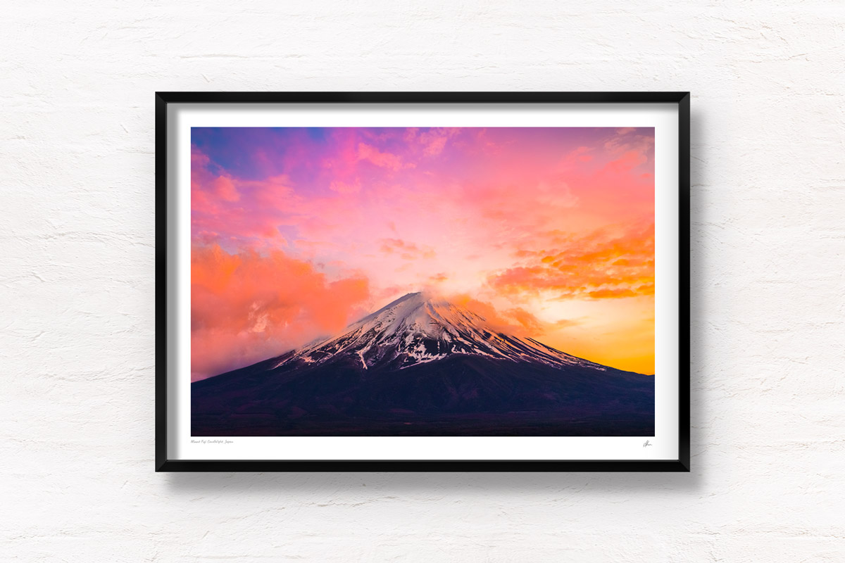 Mount Fuji Candlelight Sunset. Whispy clouds surrounding the peak of Mount Fuji on a golden pink sunset. Framed art photography, wall art prints by Allan Chan.