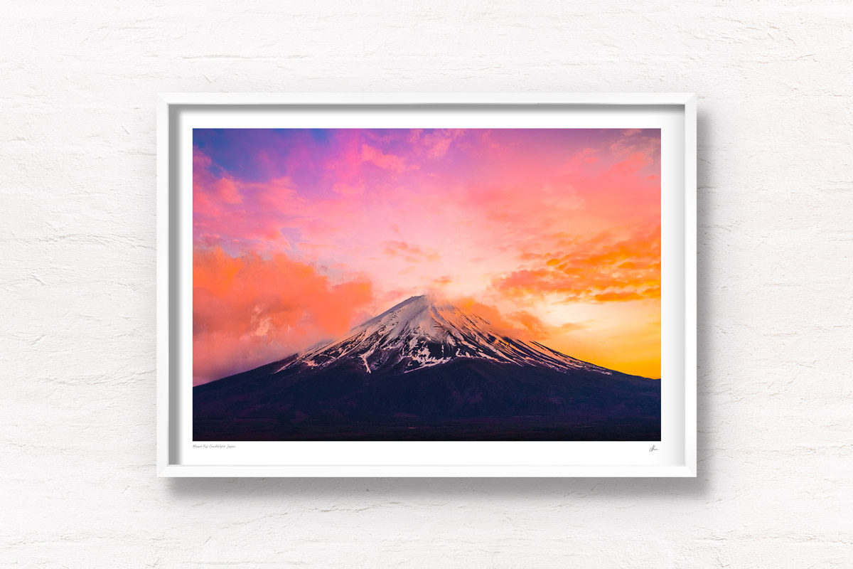 Mount Fuji Candlelight Sunset. Whispy clouds surrounding the peak of Mount Fuji on a golden pink sunset. Framed art photography, wall art prints by Allan Chan.
