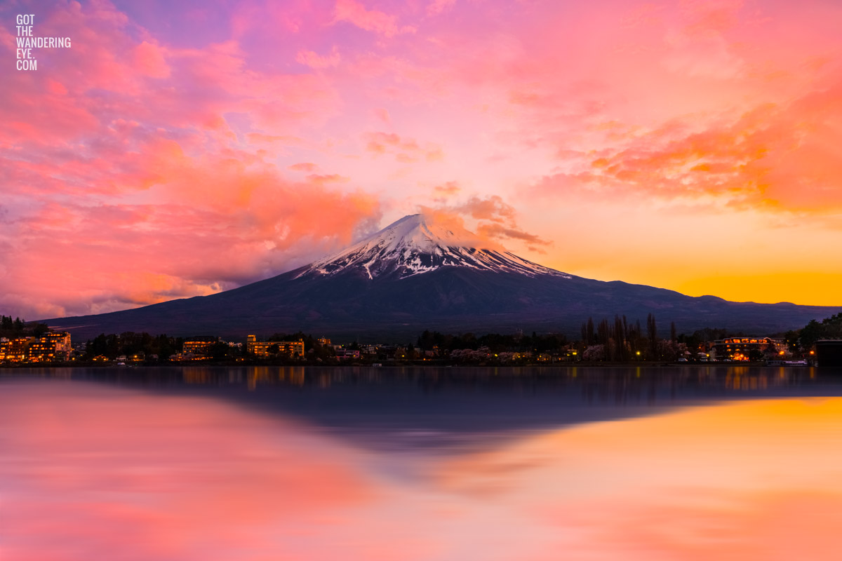 Serene Lake Kawaguchi Sunset. Vibrant pink and yellow long exposure sunset photo at the iconic Mount Fuji by Allan Chan.