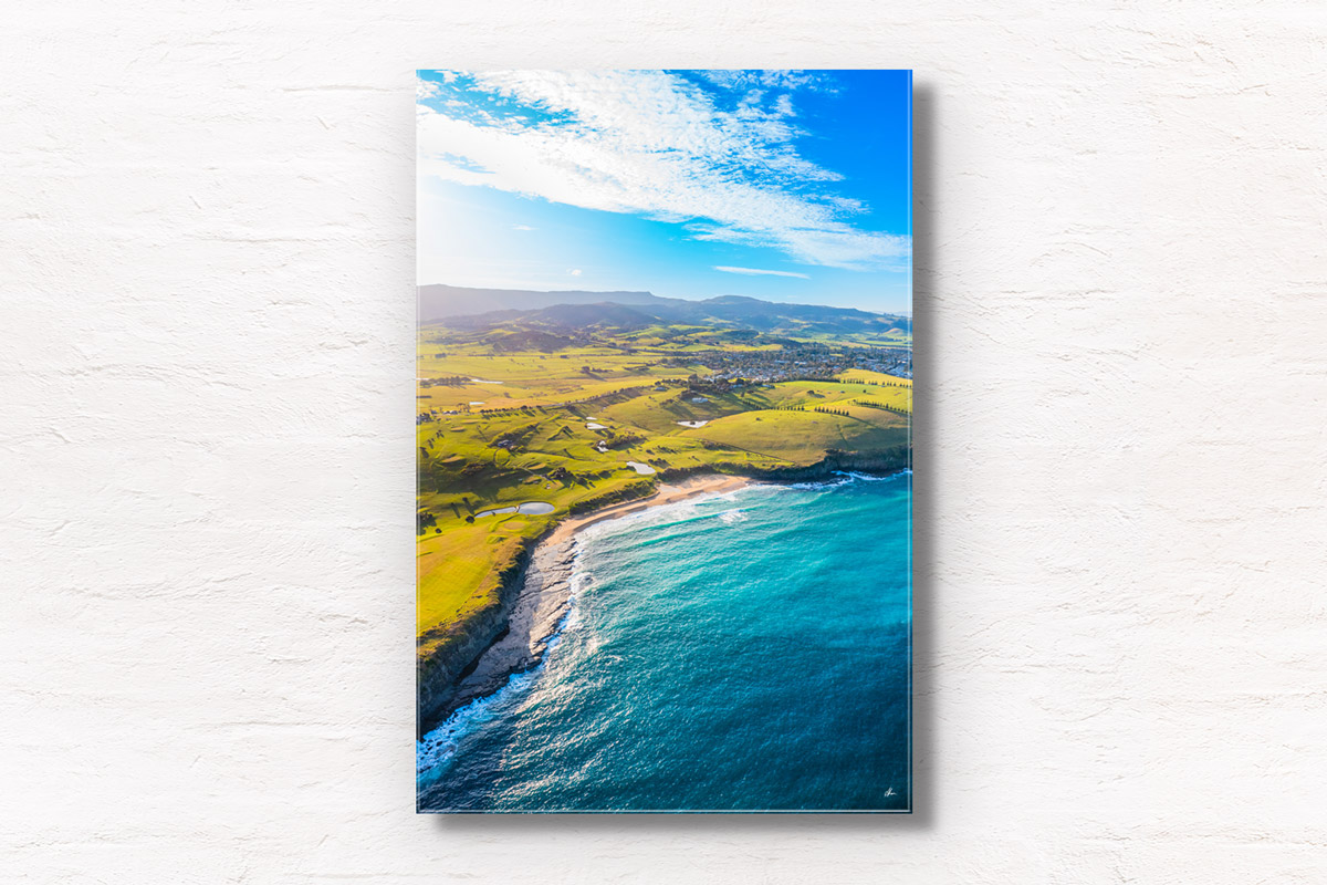 Walkers Beach Gerringong. Aerial view above the secluded and spectacular secret beach. Rolling green hilll landscape views in the background. Framed art photography, wall art prints by Allan Chan.