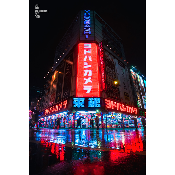 Yodobashi Camera Cyberpunk Tokyo. Iconic camera store in Shinjuku, neon lights reflection during a wet night in winter.