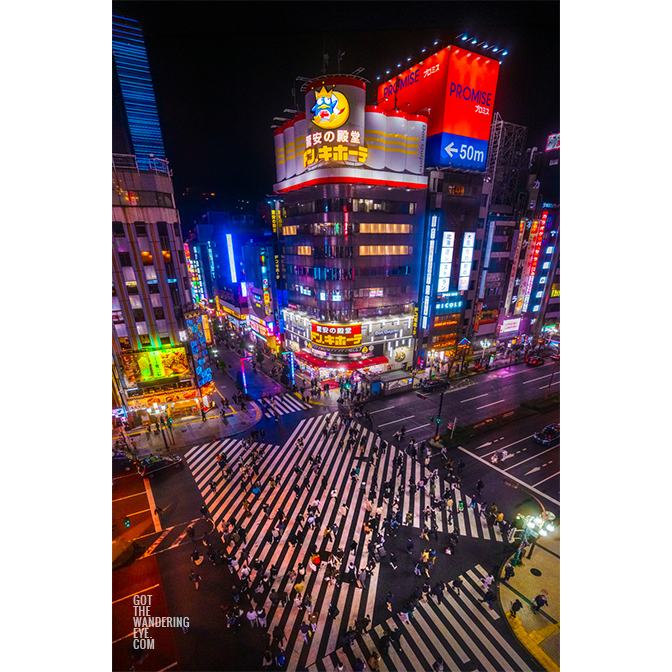Urban, aerial view above kabuki-cho crossing, illuminated at night, Shinjuku.