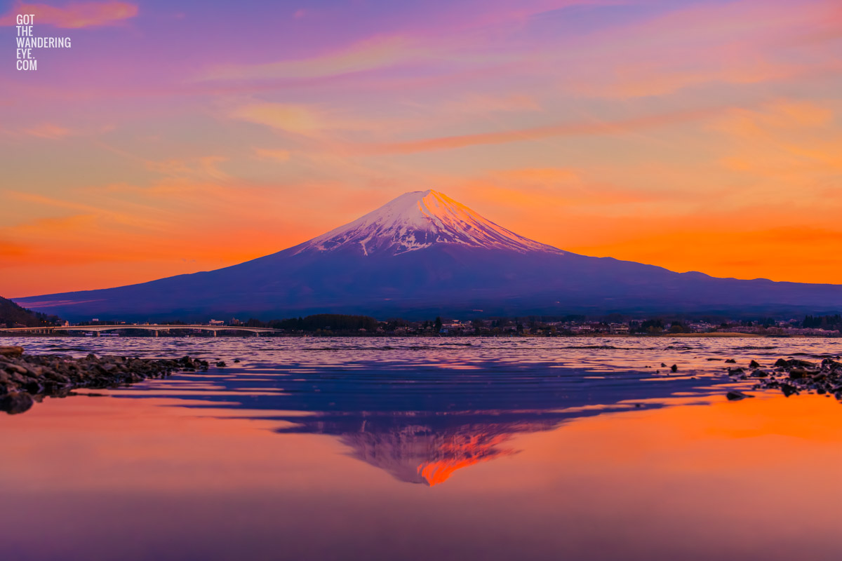 Spectacular pink sky, whispy cloud, sunset reflection at Lake Kawaguchi Fuji Sunset.