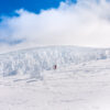 A hiker surrounded by juhyo (Snow Monsters) Mount Zao, Japan during winter.