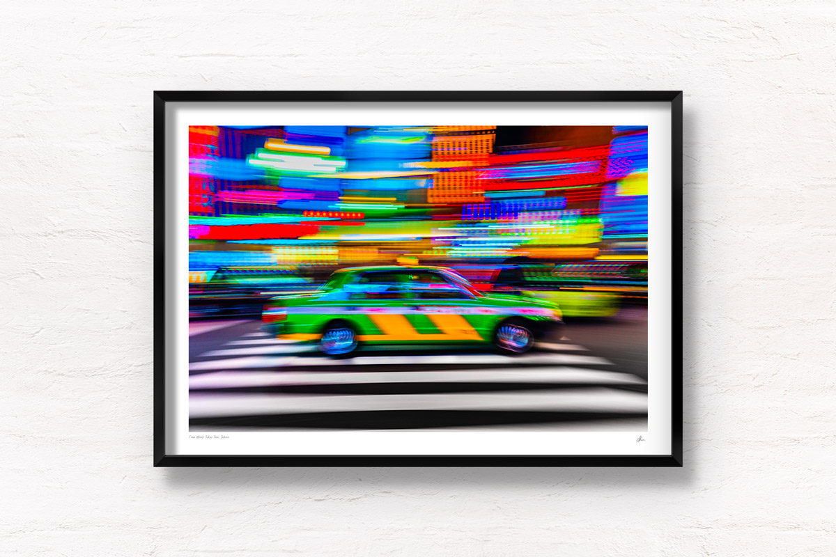 Tokyo Taxi Long Exposure night neon lights streaking in Shinjuku with the iconic striped green and yellow Tokyo Taxi. Framed art photography, wall art prints by Allan Chan.