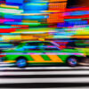 Tokyo Taxi Long Exposure night neon lights streaking in Shinjuku with the iconic striped green and yellow Tokyo Taxi.