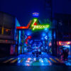 Osaka Shinsekai Cyberpunk City. Neon glowing street lights in the retro district in Osaka Japan.
